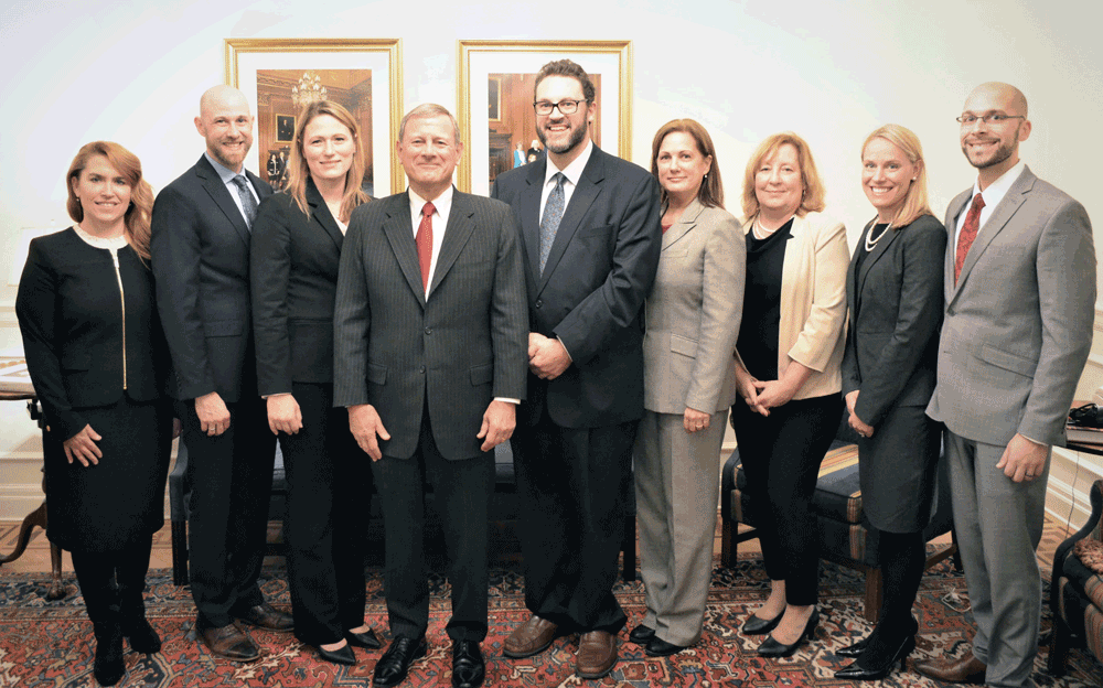 Photo (left to right): Denise Dieter, Chris Kenyon, Rachel Planas, Chief Justice John Roberts, Christian Frey, Tiffani Kase, Mary Kilgus, Liz and Austin White.