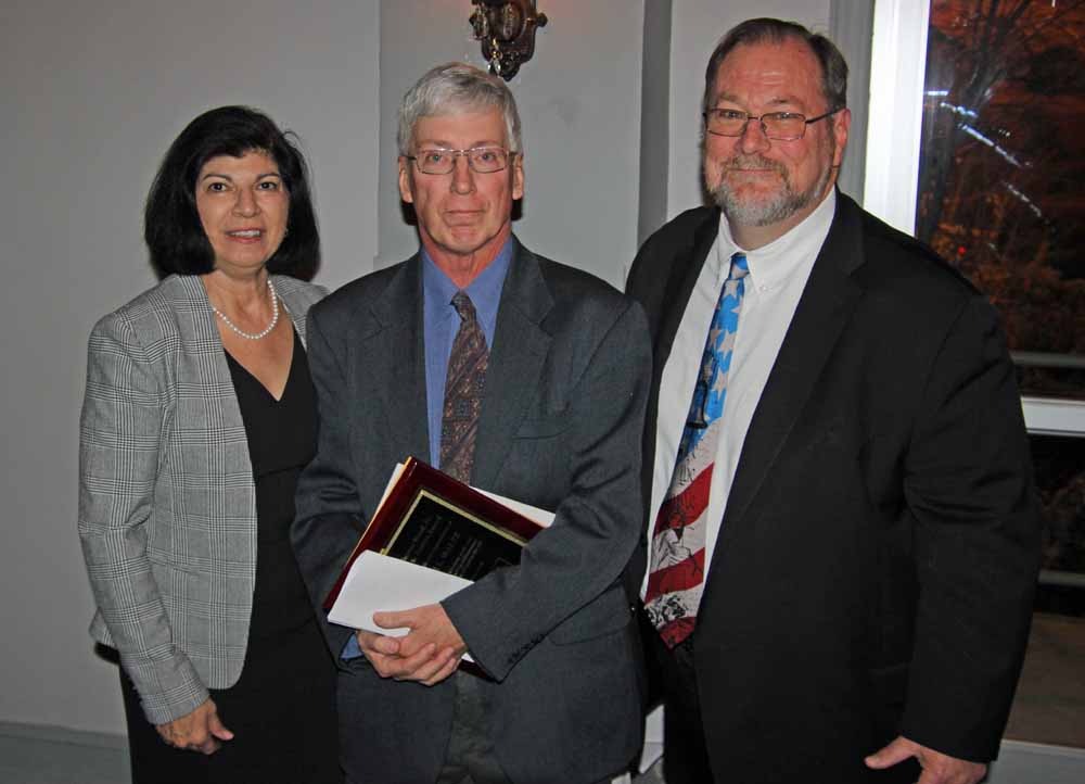 Anne N. John, PBA President and David Keller Trevaskis presenting the PBA pro bono award to Kristine's husband Steve Sorage