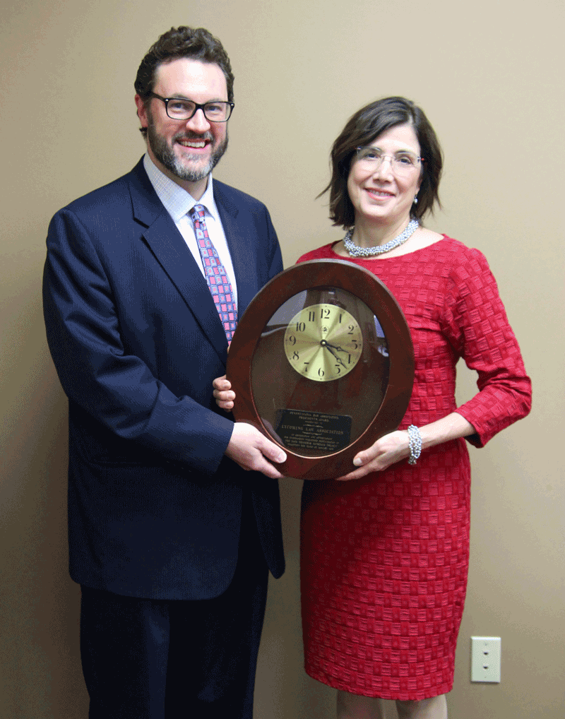 Past President Frey passing the clock to current President Lovecchip