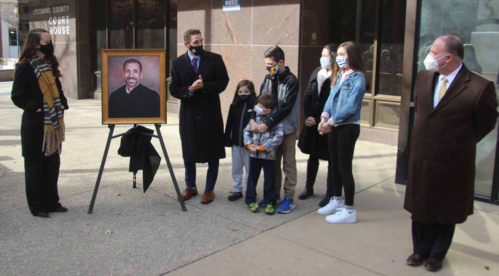 Judge Tira and family, LLA President Martino and Whitney Hart with Judge Tira's portrait