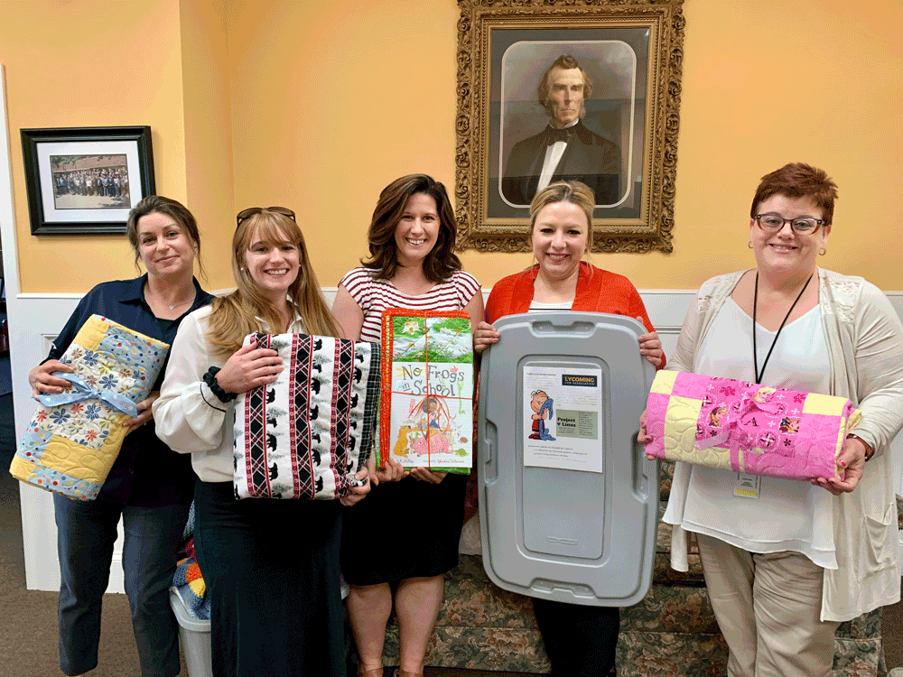 Members Taylor Buchler, Kirsten Gardner and Greta Davis, with staffers from the DA's office.