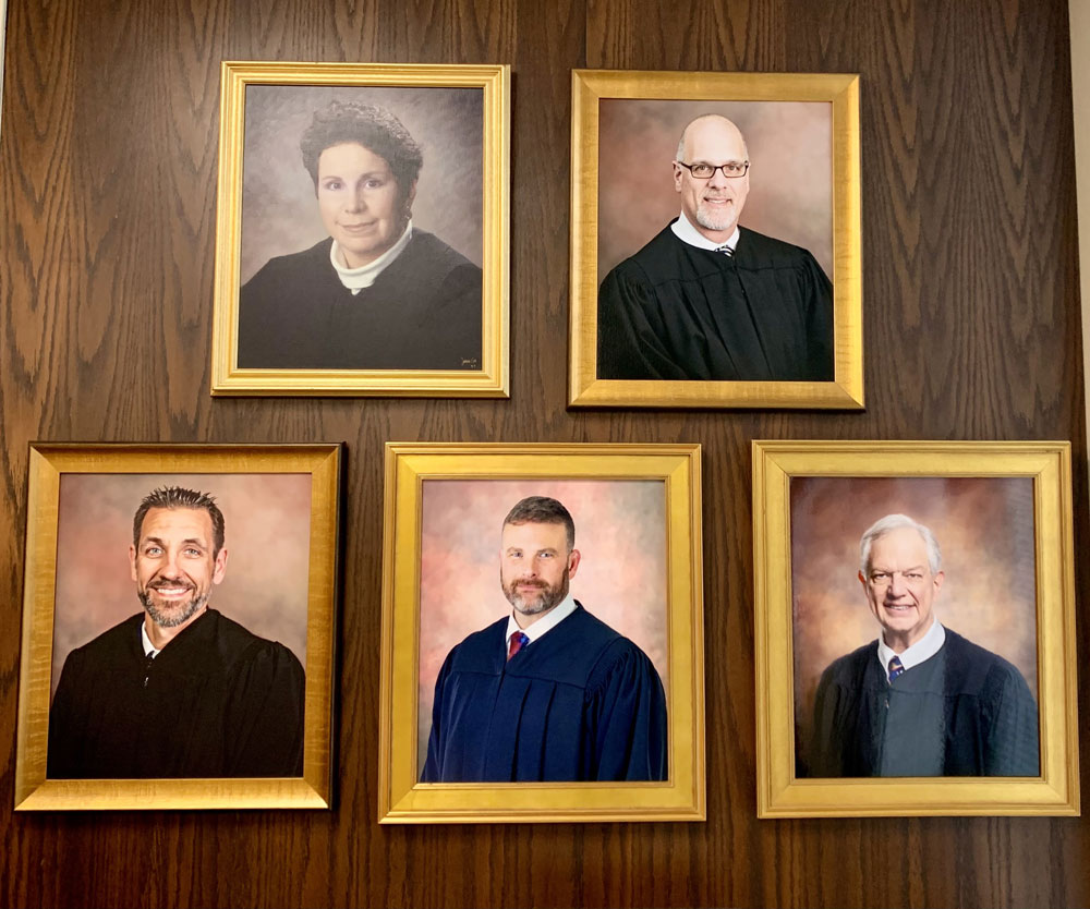 Portraits of Judges Butts, Linhardt, Tira, Carlucci and Gardner.