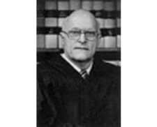 In Memoriam: Robert James Wollet (1927-90)